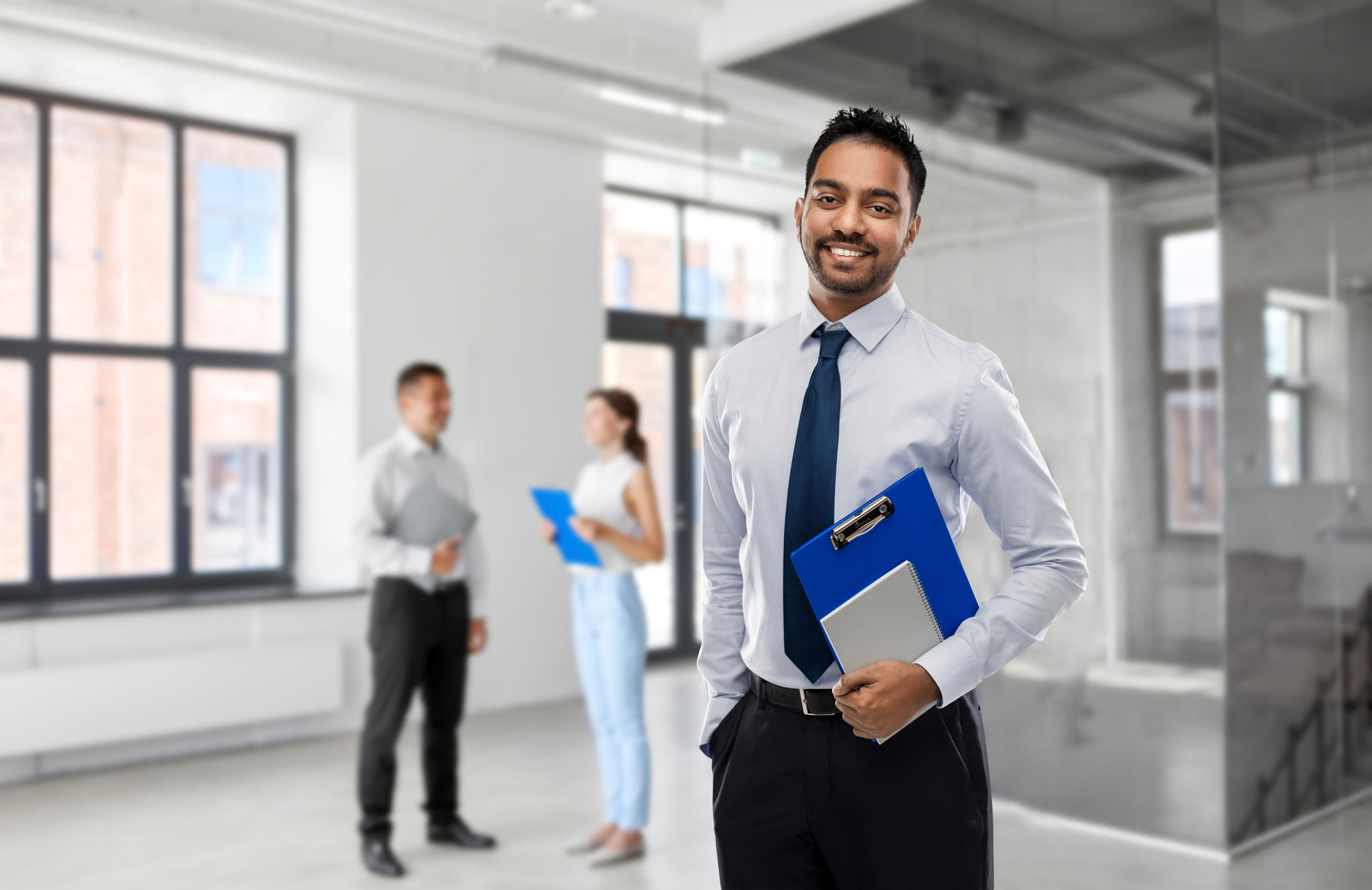 Indian businessman or realtor in empty office room